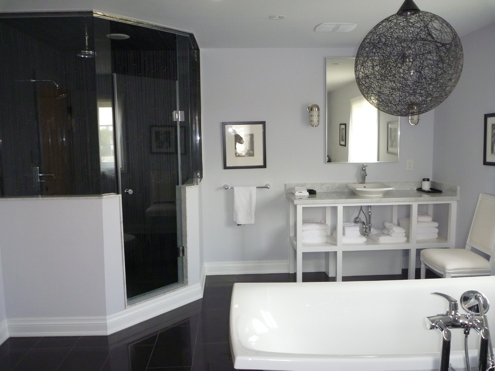 Inspiration for a contemporary bathroom in Toronto with a vessel sink, open cabinets, white cabinets, a freestanding tub, a corner shower and black tile.