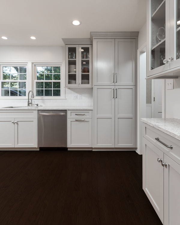 Open concept kitchen - large transitional l-shaped open concept kitchen idea with shaker cabinets and a peninsula