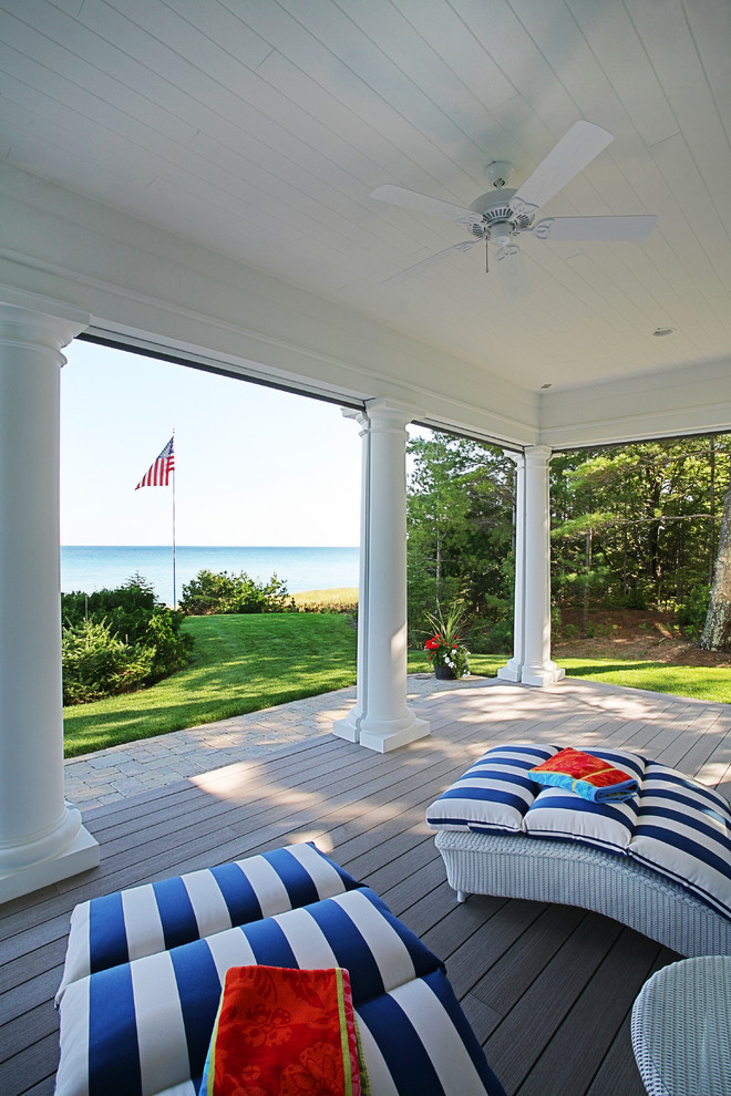 Inspiration for an expansive traditional backyard screened-in verandah in Grand Rapids with decking.