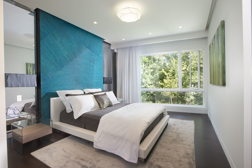 Large contemporary master bedroom in Miami with green walls.