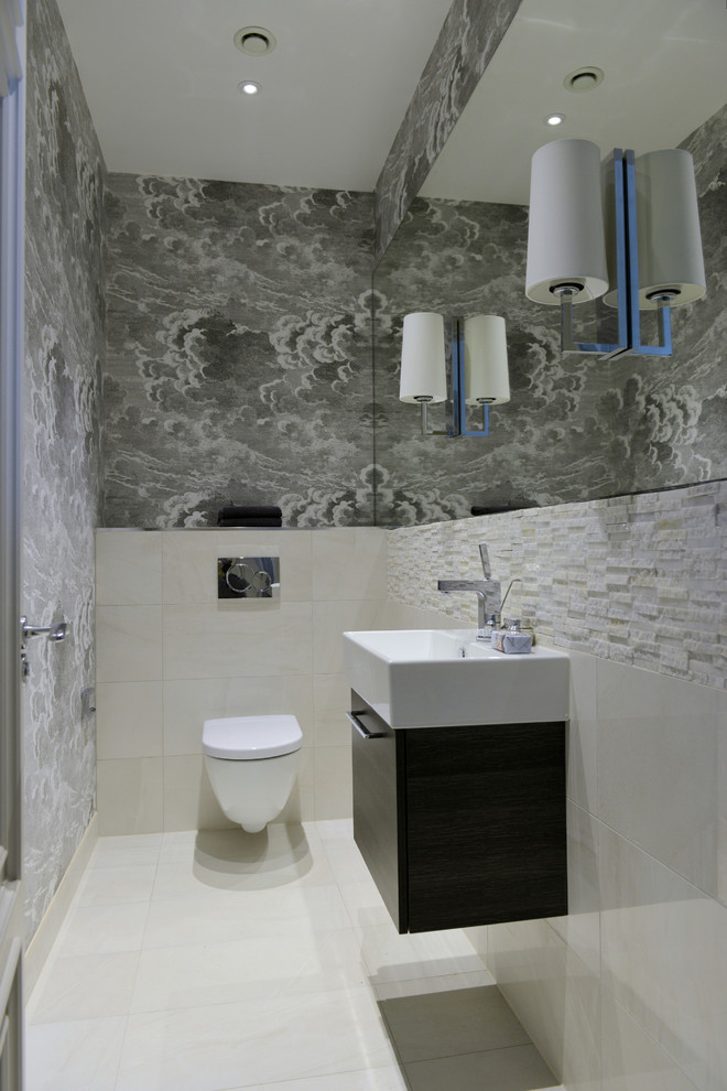 Small contemporary bathroom in Gloucestershire with flat-panel cabinets, brown cabinets, a wall-mount toilet, white tile, porcelain tile, grey walls, porcelain floors, a wall-mount sink and laminate benchtops.