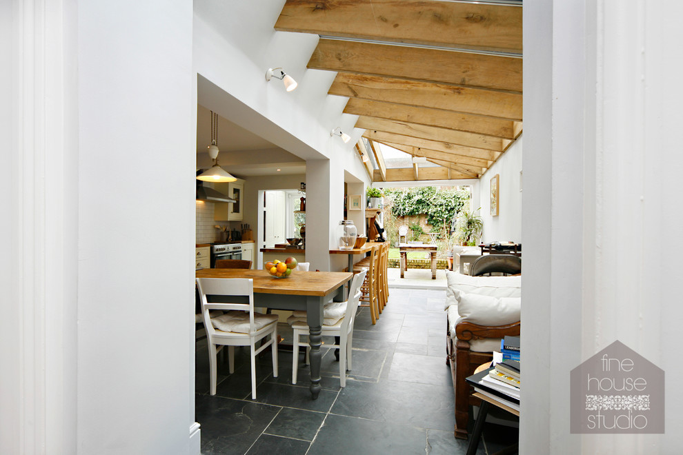 Example of a mid-sized mountain style slate floor sunroom design in Gloucestershire with a glass ceiling
