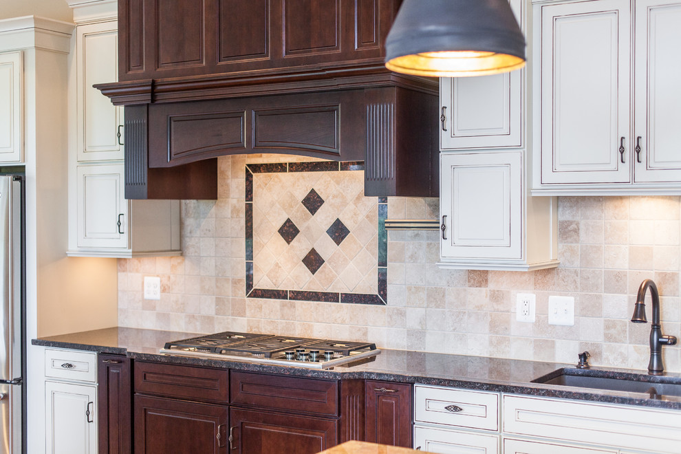 Huge transitional medium tone wood floor eat-in kitchen photo in DC Metro with raised-panel cabinets, granite countertops, stainless steel appliances and an island