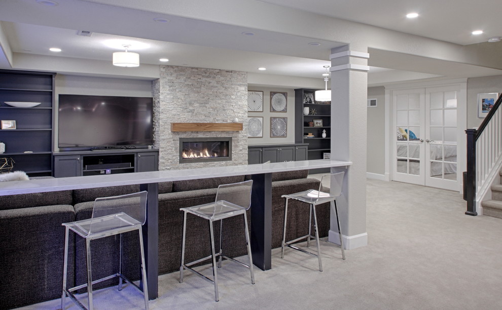 Photo of a mid-sized contemporary fully buried basement in Denver with grey walls, carpet, a stone fireplace surround and a ribbon fireplace.
