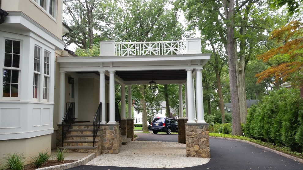 Inspiration for a large traditional attached one-car porte cochere in New York.