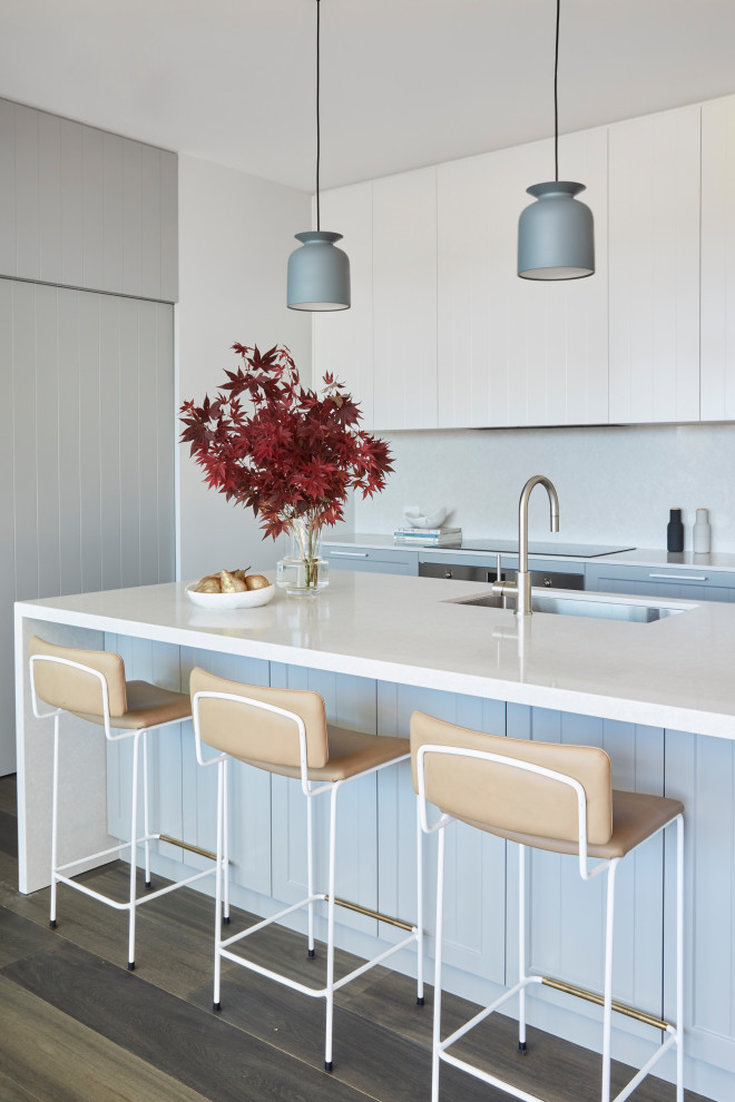 Medium sized contemporary l-shaped kitchen in Sydney with a submerged sink, engineered stone countertops, engineered quartz splashback, dark hardwood flooring, an island and brown floors.