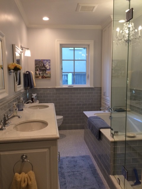 Photo of a small traditional master bathroom in Los Angeles with white cabinets, an undermount tub, a corner shower, blue tile, subway tile, porcelain floors, an undermount sink, engineered quartz benchtops, grey floor and a hinged shower door.