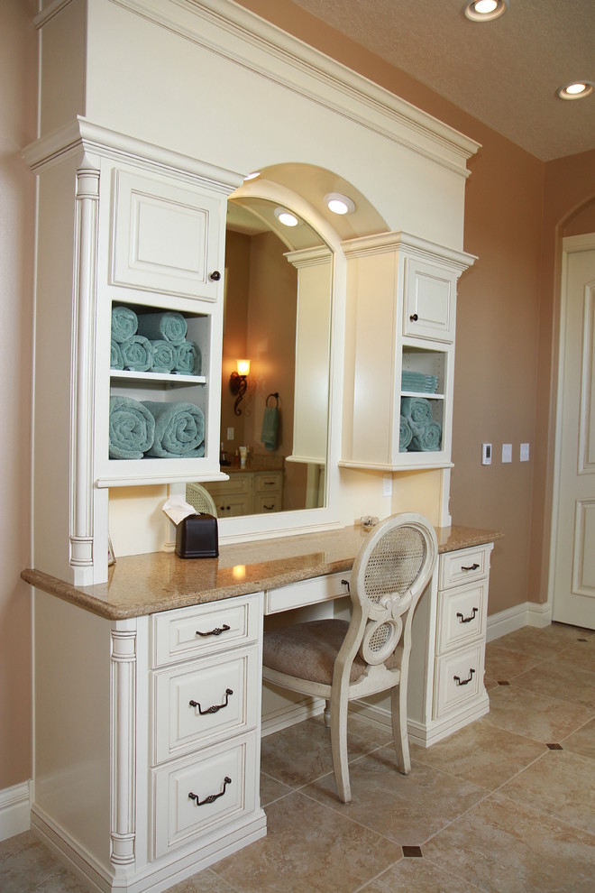 Design ideas for a mid-sized traditional powder room in Wichita with raised-panel cabinets, white cabinets, ceramic tile, ceramic floors, engineered quartz benchtops and beige walls.