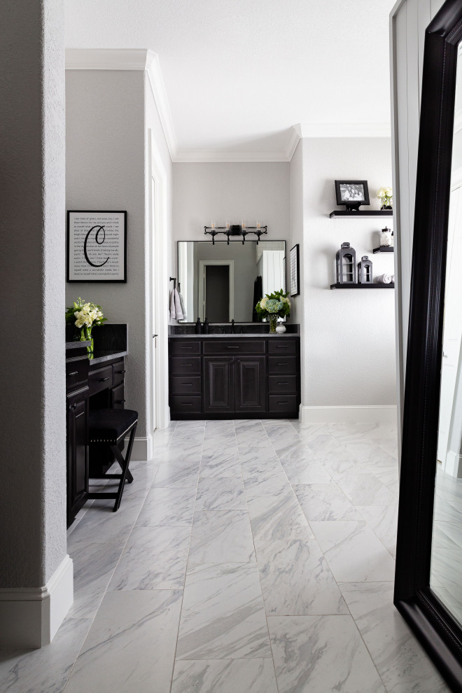 This is an example of a large transitional master bathroom in Dallas with raised-panel cabinets, black cabinets, a freestanding tub, a double shower, a two-piece toilet, yellow tile, mosaic tile, grey walls, porcelain floors, an undermount sink, quartzite benchtops, grey floor, an open shower, grey benchtops, a niche, a double vanity, a built-in vanity and planked wall panelling.
