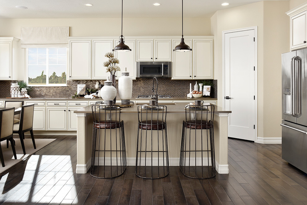 Inspiration for a contemporary kitchen in Denver with stainless steel appliances and with island.