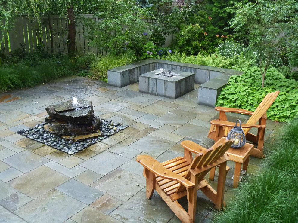 Inspiration for a contemporary patio in Seattle with concrete slab and no cover.