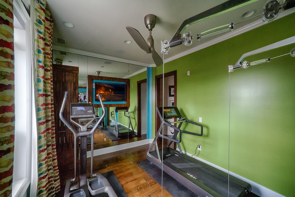 Small contemporary multipurpose gym in Philadelphia with green walls and medium hardwood floors.