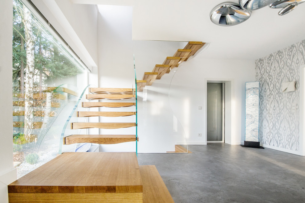 This is an example of a mid-sized contemporary wood l-shaped staircase in Munich.