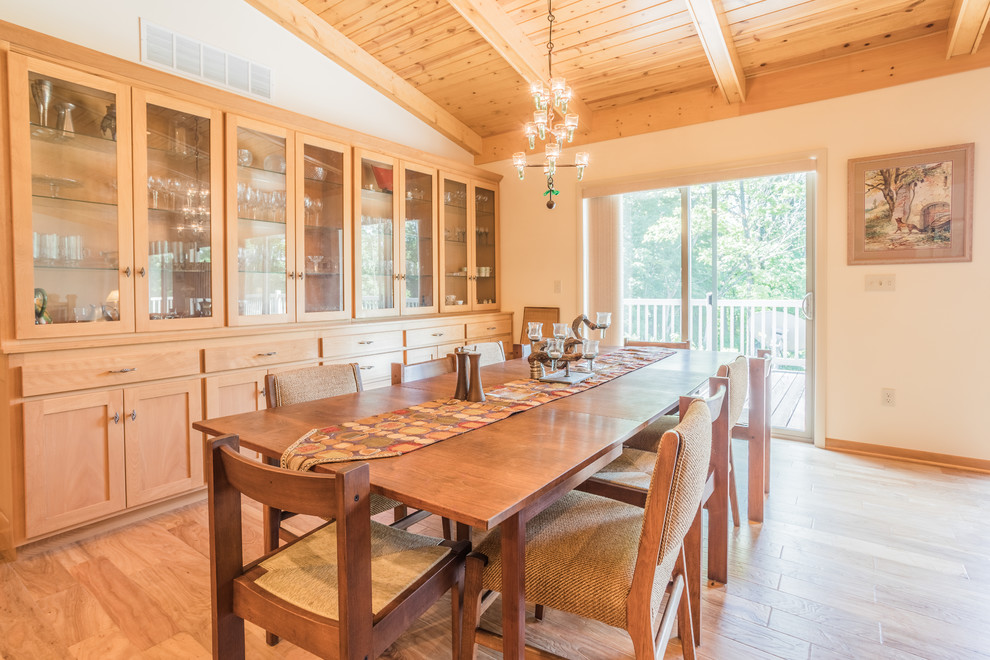 Inspiration for a large transitional light wood floor and beige floor great room remodel with white walls