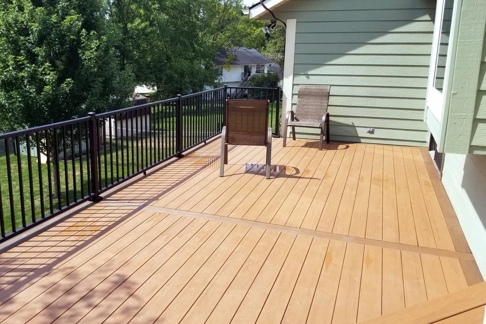 Inspiration for a large backyard deck remodel with no cover