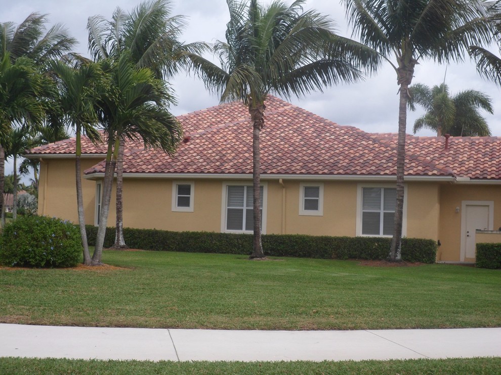 This is an example of a mid-sized mediterranean exterior in Miami.