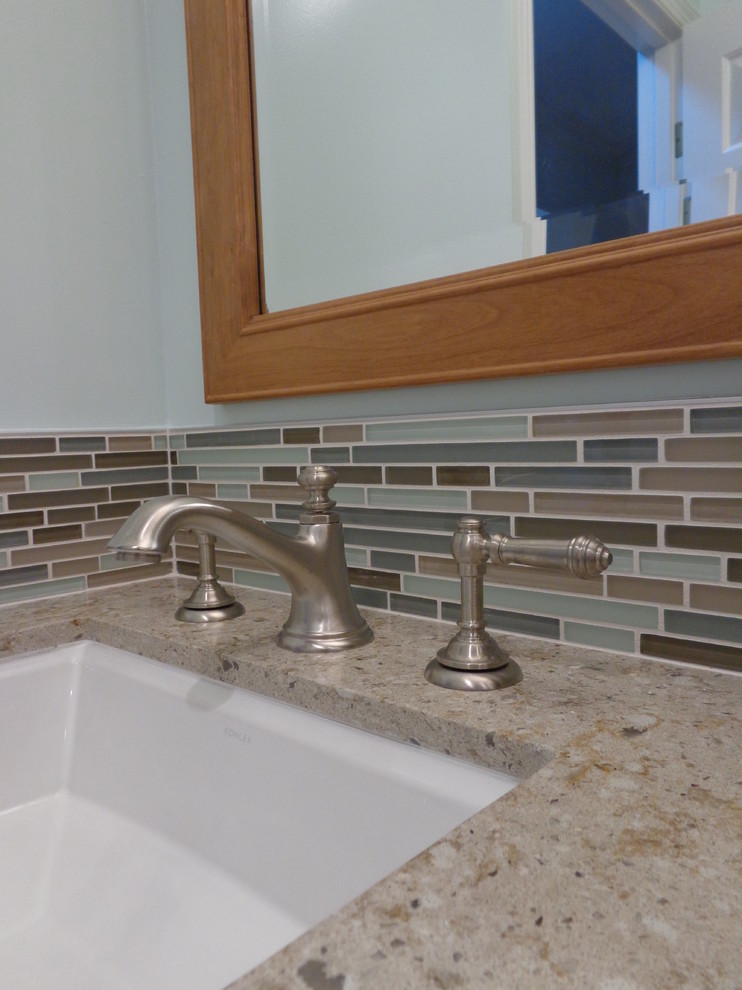 Example of a transitional multicolored tile bathroom design in Los Angeles with raised-panel cabinets, medium tone wood cabinets and quartz countertops