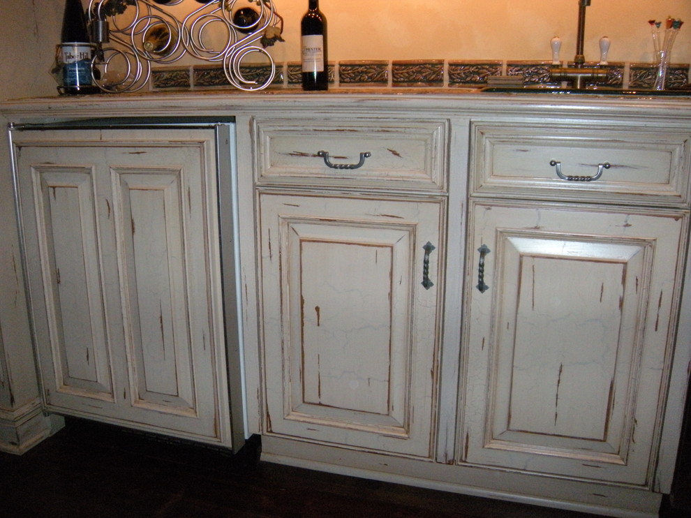 Photo of a mid-sized traditional separate kitchen in Chicago with light wood cabinets, tile benchtops and with island.