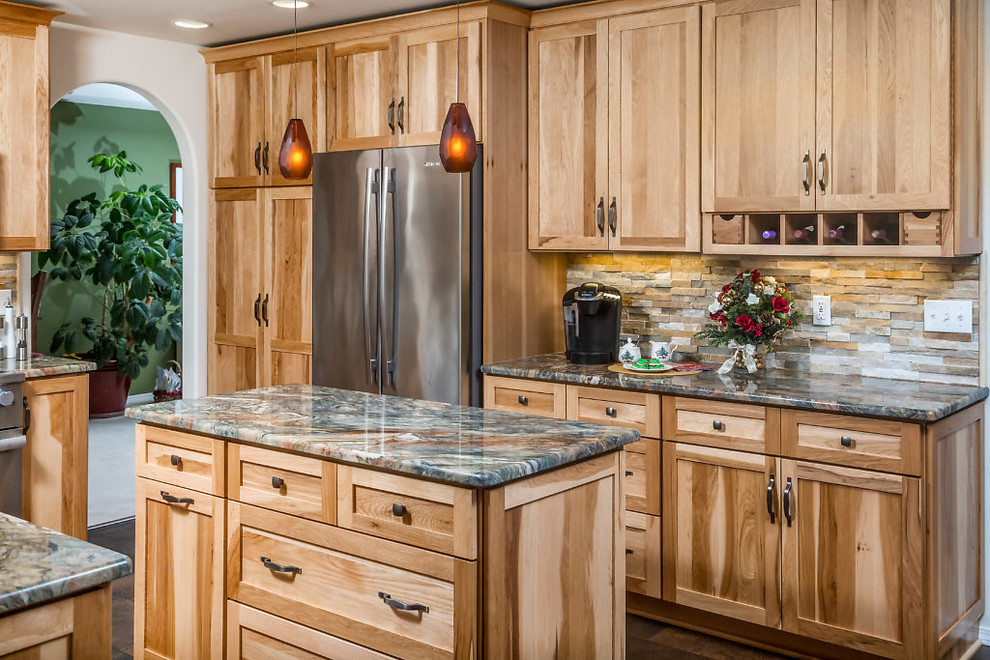 Inspiration for a mid-sized rustic vinyl floor kitchen remodel with an undermount sink, recessed-panel cabinets, light wood cabinets, granite countertops, stainless steel appliances and an island