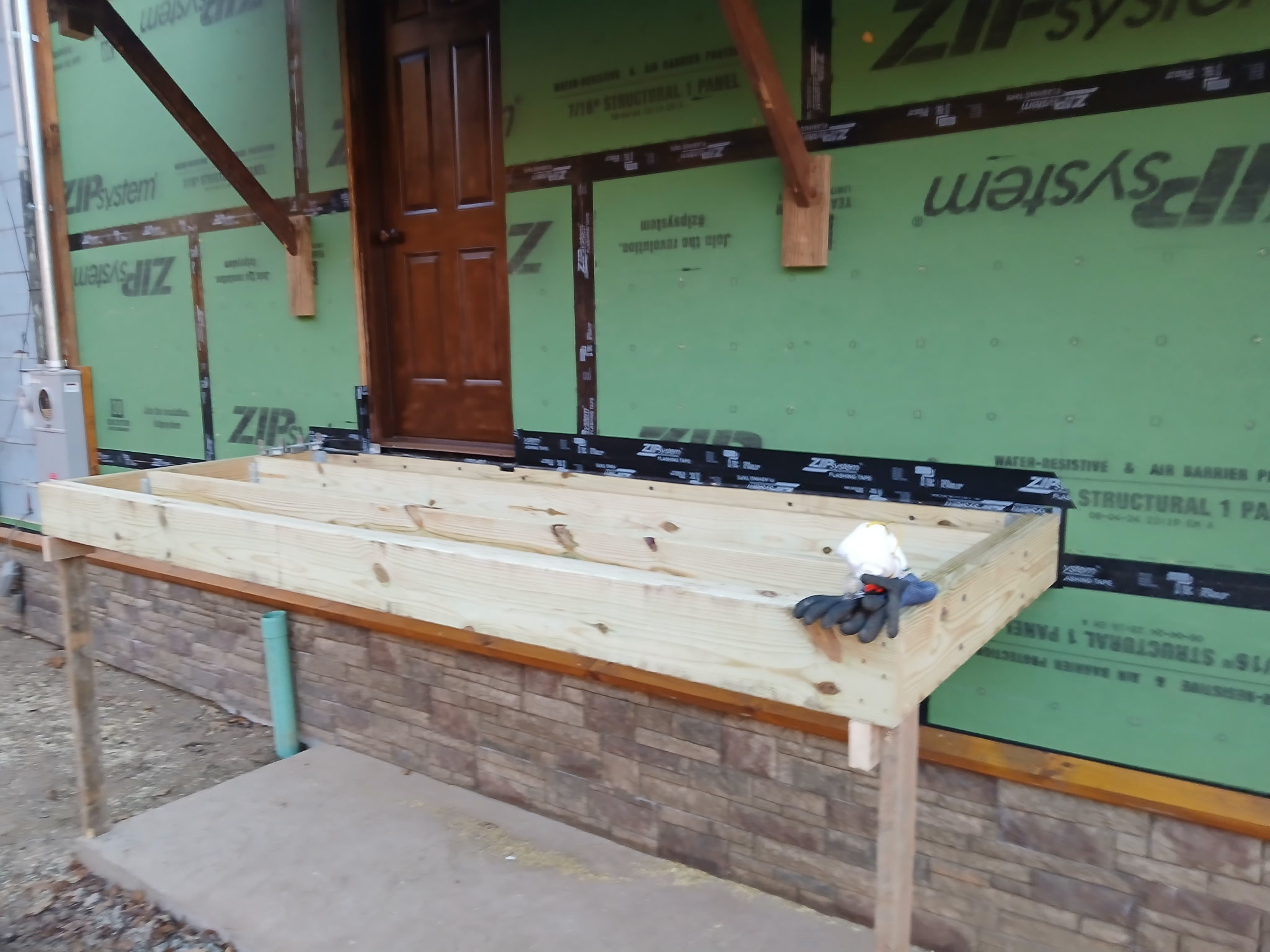 Log Siding, Stamped Concrete and Post and Beam Carport