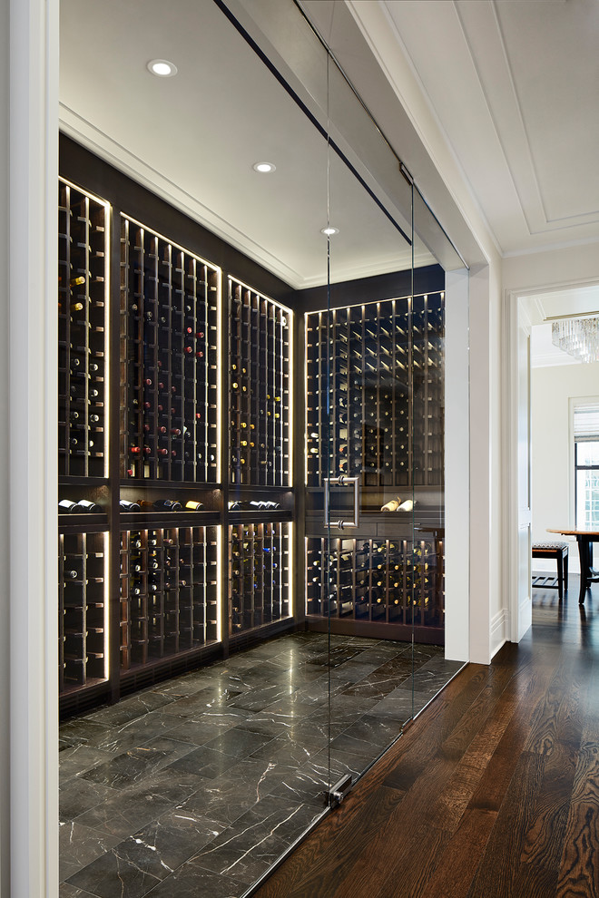 This is an example of a mid-sized transitional wine cellar in Chicago with marble floors, storage racks and black floor.