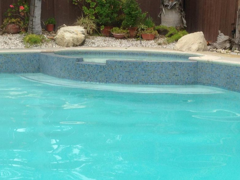 Hot tub - large transitional backyard tile and custom-shaped natural hot tub idea in Los Angeles