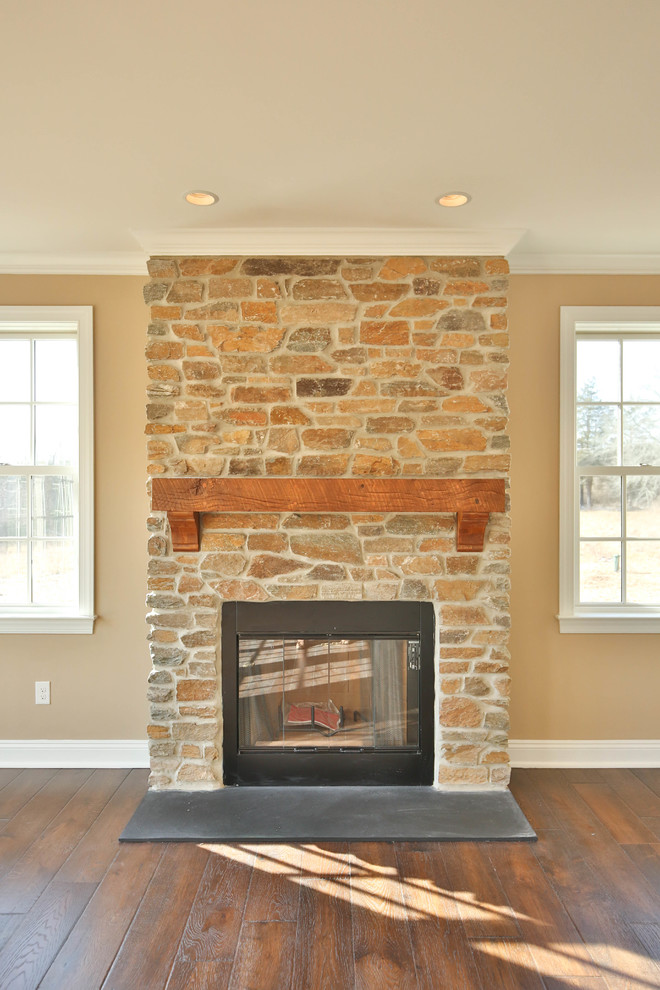 Mid-sized country open concept family room in Philadelphia with beige walls, dark hardwood floors, a standard fireplace and a brick fireplace surround.