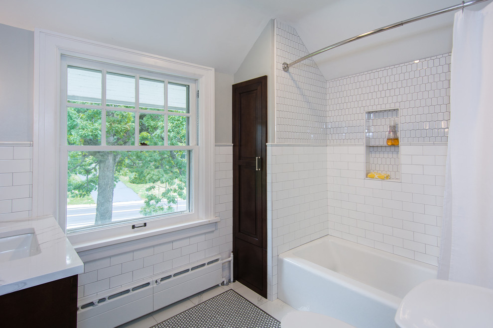 Small classic bathroom in Other with dark wood cabinets, a shower/bath combination, white tiles, metro tiles, white walls, ceramic flooring and a shower curtain.
