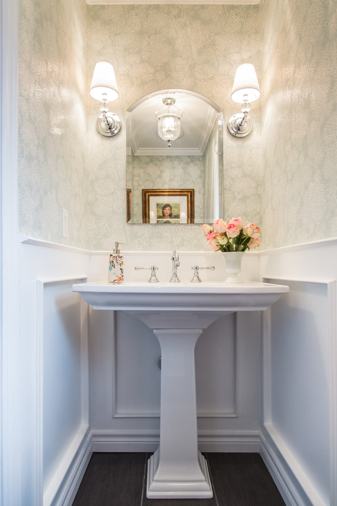 Traditional powder room in Toronto with a pedestal sink and multi-coloured walls.