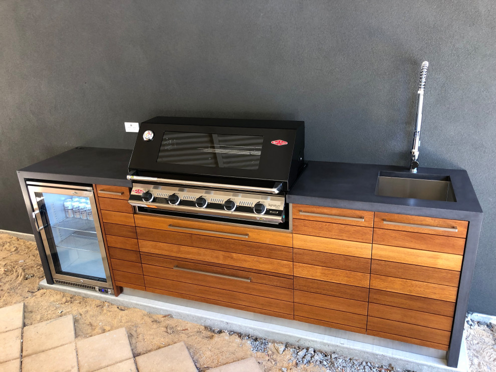 Outdoor Kitchen polished concrete bench tops & reclaimed timber doors