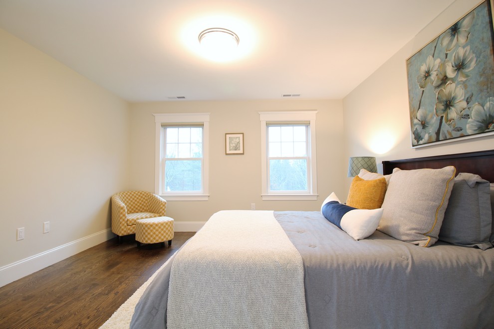 Inspiration for a large transitional guest dark wood floor and brown floor bedroom remodel in Boston with beige walls