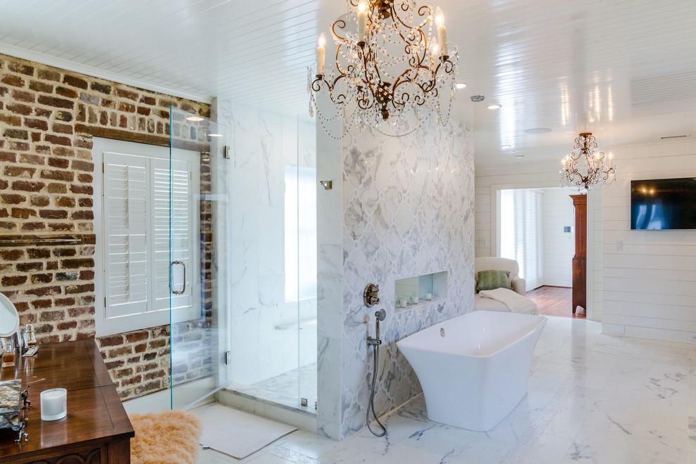 Design ideas for a large transitional master bathroom in Charleston with beaded inset cabinets, white cabinets, a freestanding tub, a double shower, a one-piece toilet, multi-coloured walls, marble floors, an undermount sink, marble benchtops, white floor and a hinged shower door.
