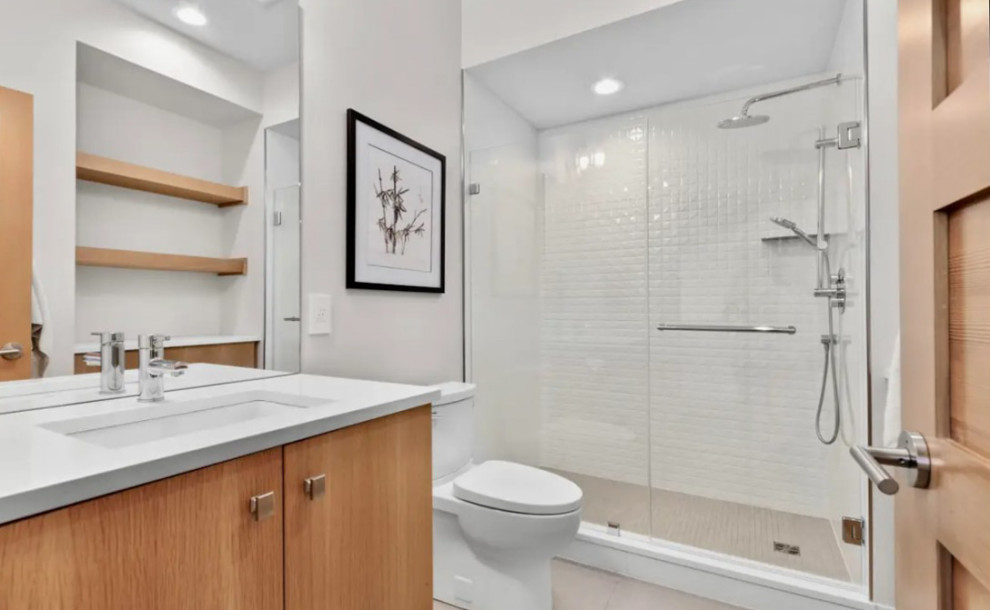 Doorless shower - large transitional kids' porcelain tile doorless shower idea with a hinged shower door and a floating vanity