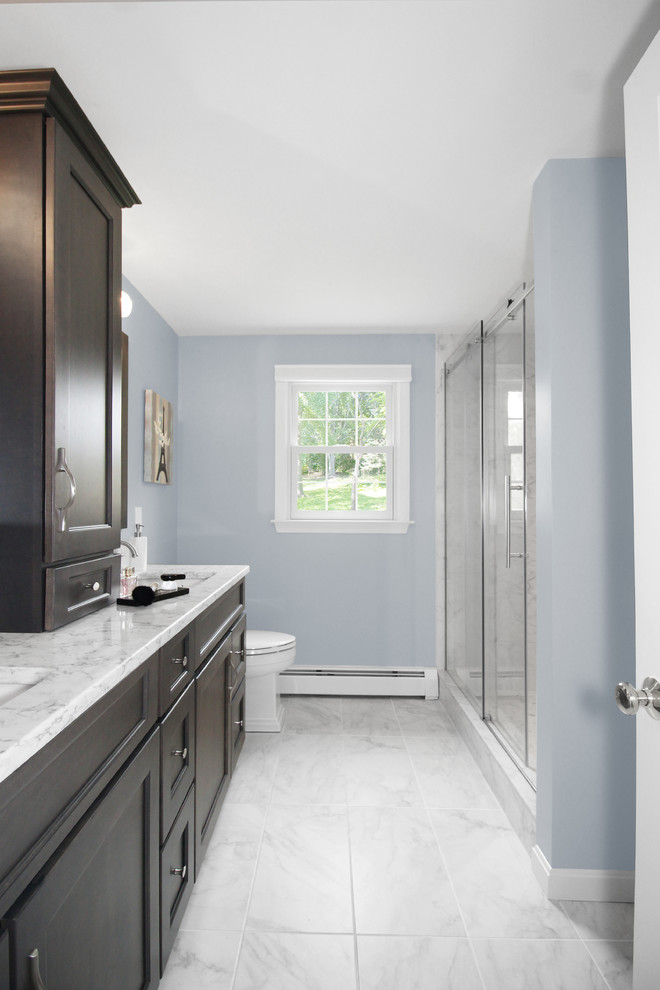 Mid-sized transitional master bathroom in Boston with shaker cabinets, grey cabinets, an alcove shower, a two-piece toilet, white tile, porcelain tile, blue walls, porcelain floors, an undermount sink, engineered quartz benchtops, white floor, a sliding shower screen and grey benchtops.