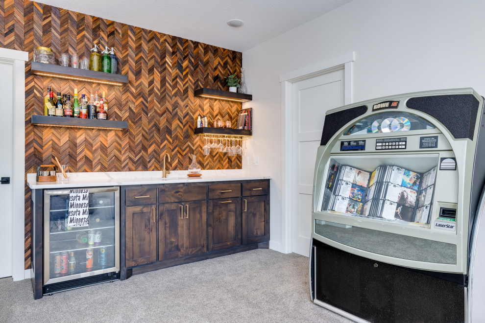 Inspiration for a mid-sized arts and crafts wet bar in Other with an undermount sink, shaker cabinets, dark wood cabinets, quartz benchtops, multi-coloured splashback, timber splashback, carpet, beige floor and white benchtop.