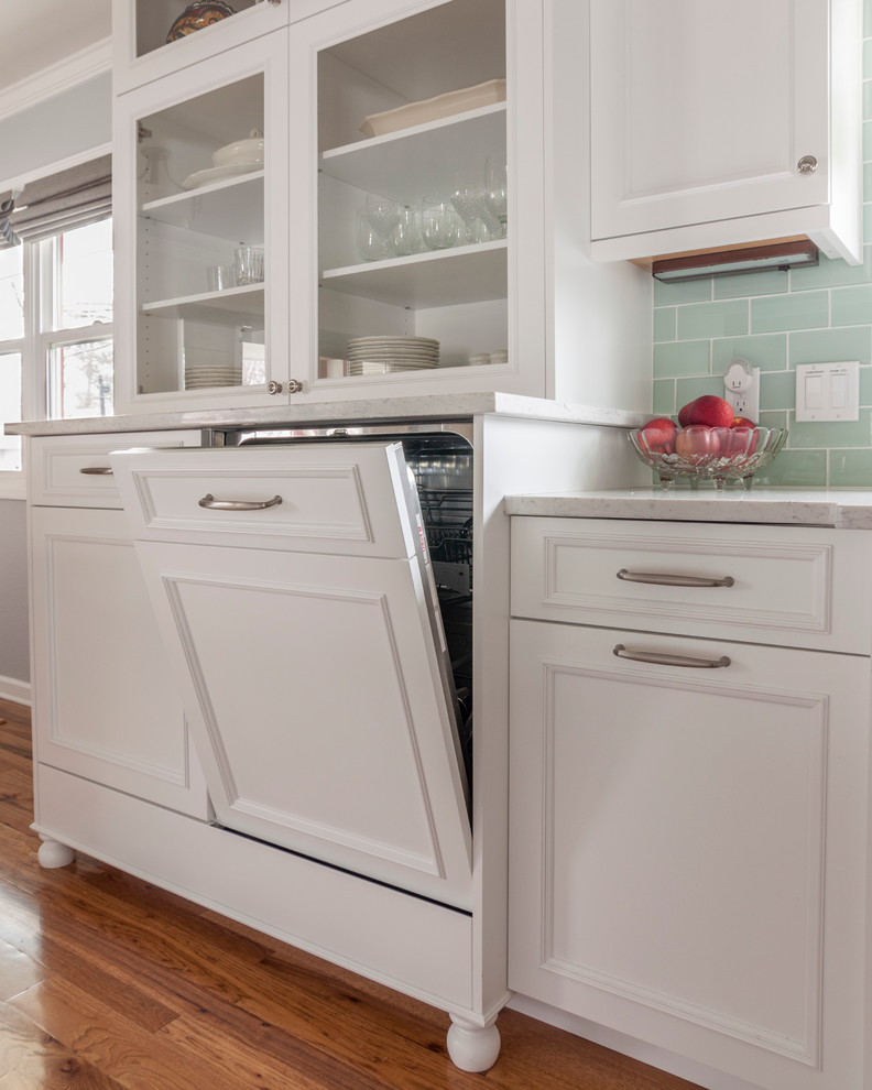 Inspiration for a mid-sized transitional medium tone wood floor home design remodel in Denver with a single-bowl sink, flat-panel cabinets, yellow cabinets, quartz countertops, blue backsplash, glass tile backsplash, white appliances and an island