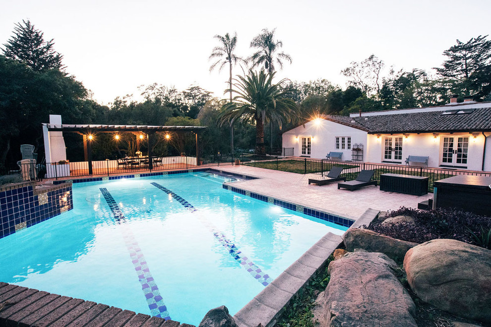 Hot tub - mid-sized mediterranean backyard concrete paver and custom-shaped natural hot tub idea in Santa Barbara