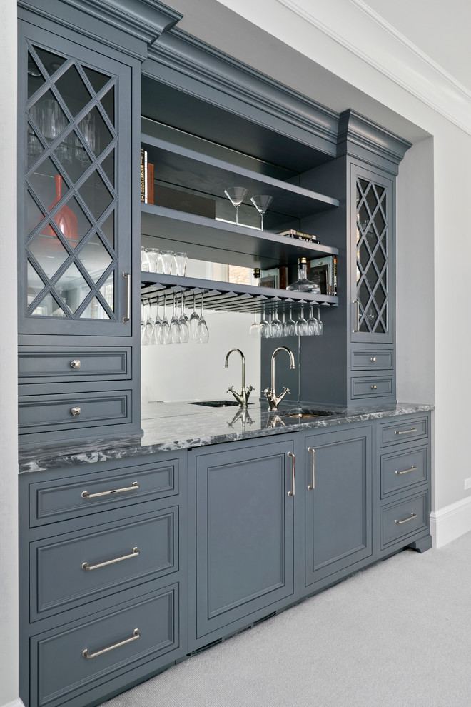 Design ideas for a small transitional single-wall wet bar in Chicago with an undermount sink, recessed-panel cabinets, grey cabinets, marble benchtops, grey splashback, mirror splashback and carpet.