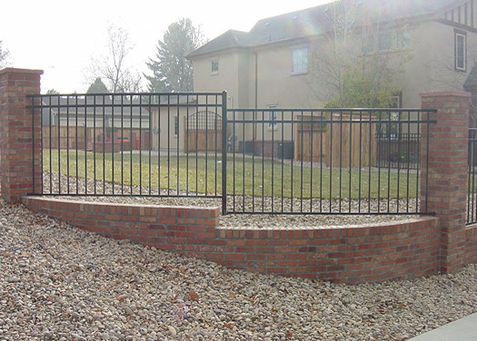Mid-sized traditional backyard partial sun formal garden in Denver with a garden path and gravel for summer.
