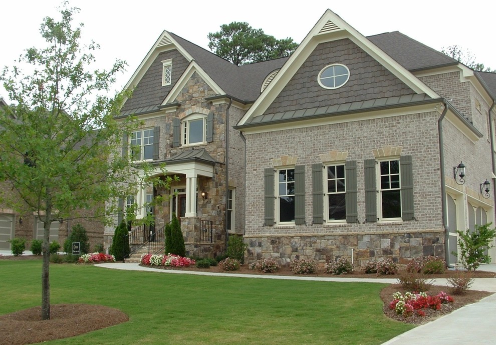Inspiration for a traditional two-storey brick grey exterior in Atlanta.