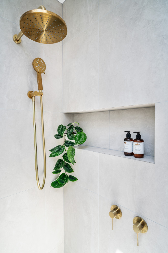 Mid-sized contemporary bathroom in Melbourne with a corner shower and an open shower.