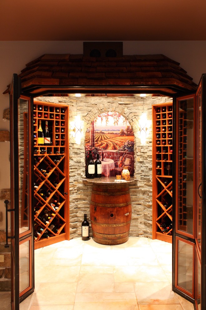 Mediterranean wine cellar in Los Angeles with diamond bins and beige floor.