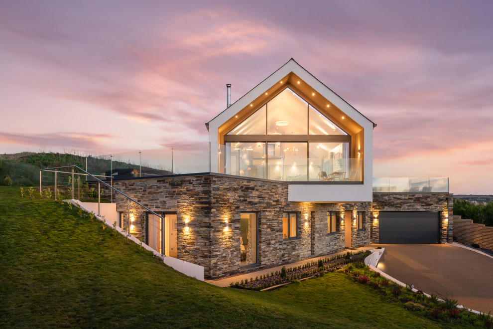 Inspiration for a large contemporary two-storey house exterior in Cornwall with a gable roof.