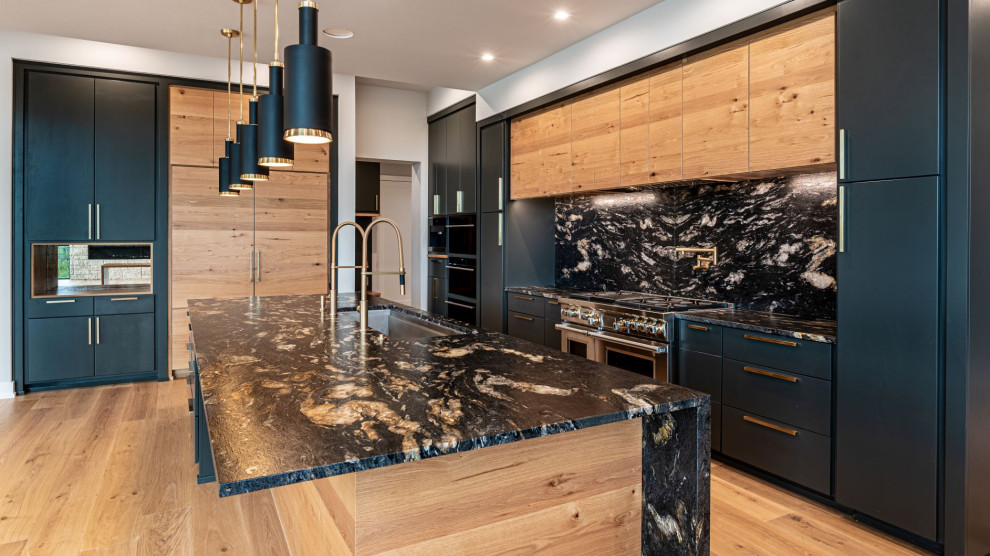 Design ideas for a mid-sized contemporary l-shaped kitchen in Austin with flat-panel cabinets, white cabinets, granite benchtops, multi-coloured splashback, stone tile splashback and black benchtop.