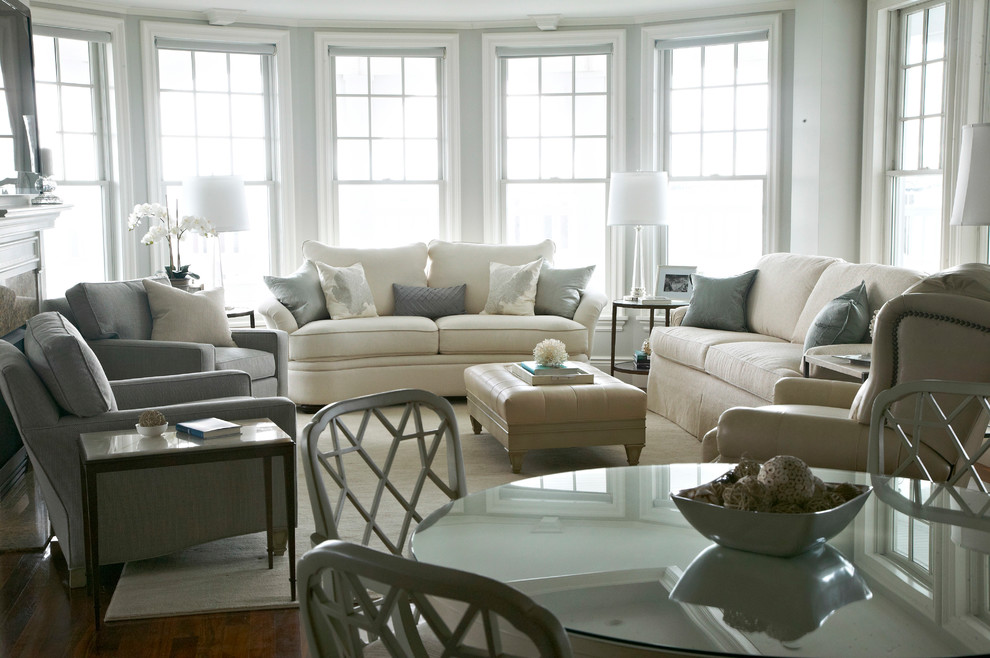 This is an example of a transitional living room in New York with grey walls.