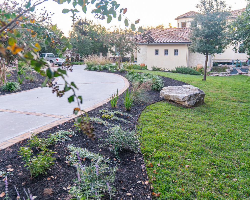 Inspiration for a large mediterranean front yard formal garden in Austin.