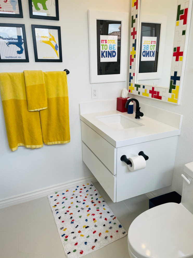 Example of a mid-sized kids' white tile and porcelain tile porcelain tile, white floor and single-sink bathroom design in Los Angeles with flat-panel cabinets, white cabinets, a one-piece toilet, white walls, an undermount sink, quartz countertops, white countertops, a niche and a floating vanity