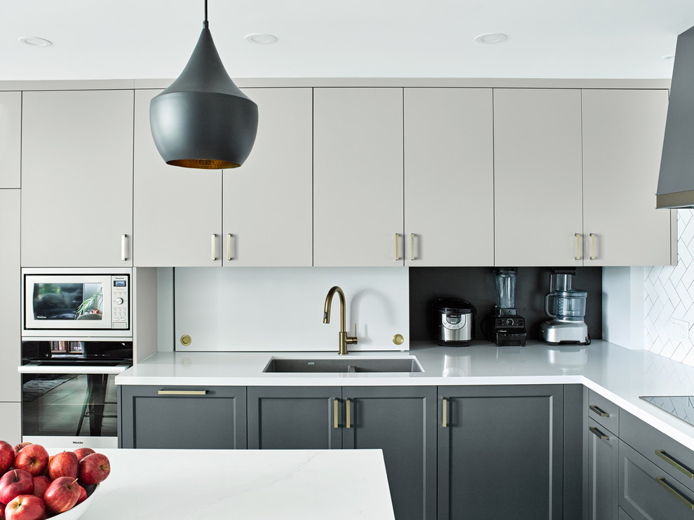 Example of a transitional kitchen design in Toronto