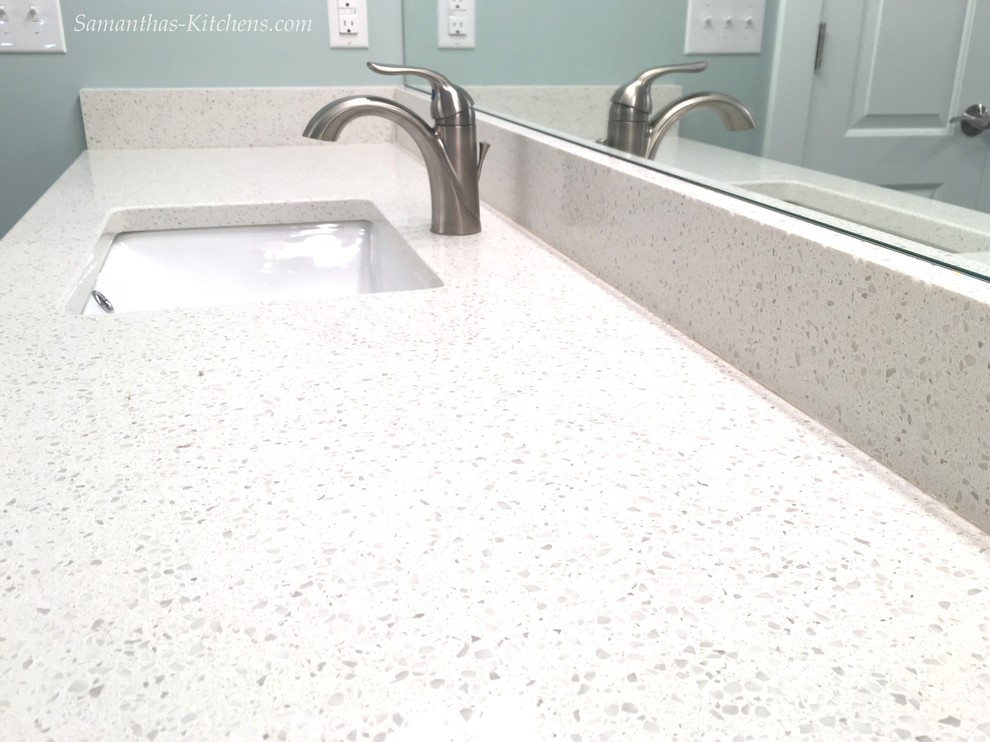 Mid-sized transitional master porcelain tile home design photo with recessed-panel cabinets, gray cabinets, blue walls, an undermount sink and quartz countertops