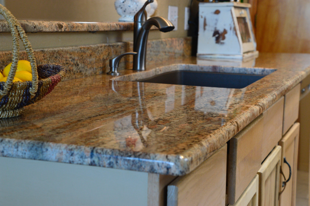 Enclosed kitchen - small rustic single-wall ceramic tile enclosed kitchen idea in Albuquerque with an undermount sink, granite countertops and no island